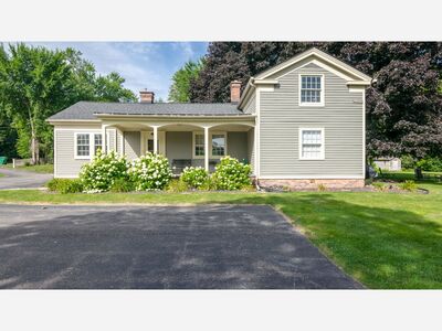 Own a piece of Saline history in this beautiful, updated historic home on Mill Pond!