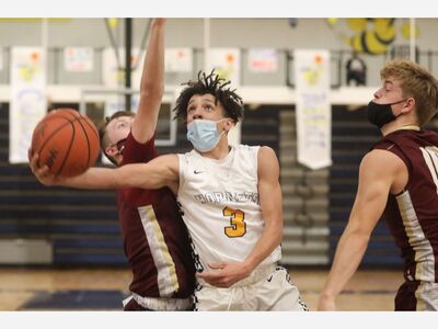 BASKETBALL: Saline Defeats Ypsilanti to Open Playoffs, Faces Huron Next