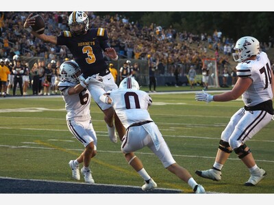 QB Carr Delivers a Mythical Night as Saline Defeats Dexter, 61-34