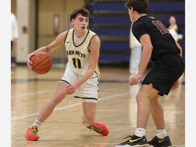 BASKETBALL: Kronberg Pours in 31, Defense Shines in Saline's Win Over Monroe
